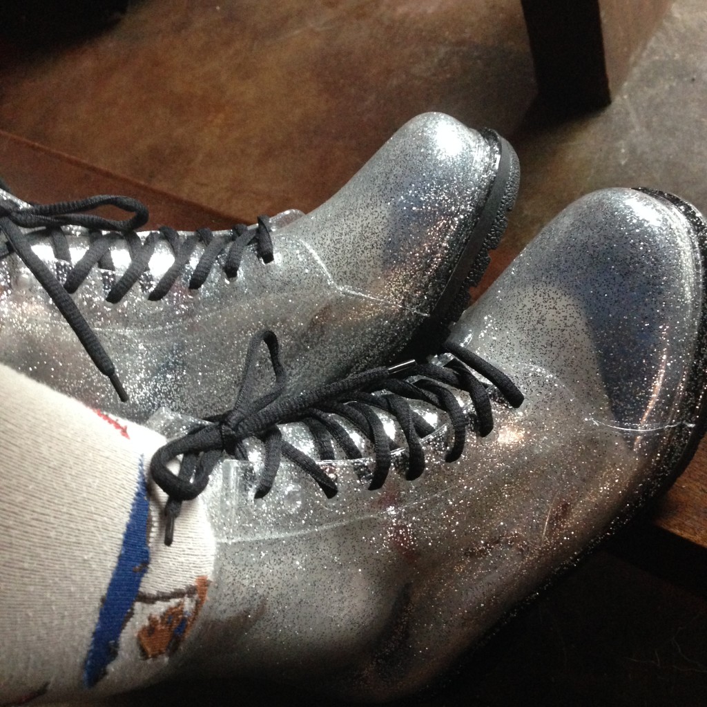 like combat boots, but fairly translucent, with a lot of silver glitter